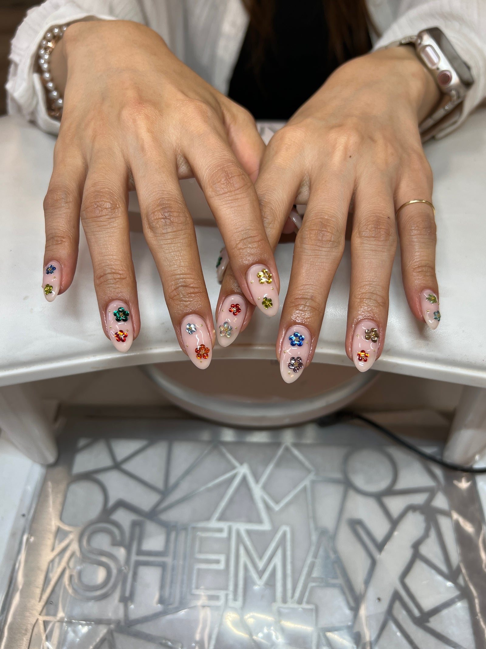 Natural nails with colorful tiny flower charms