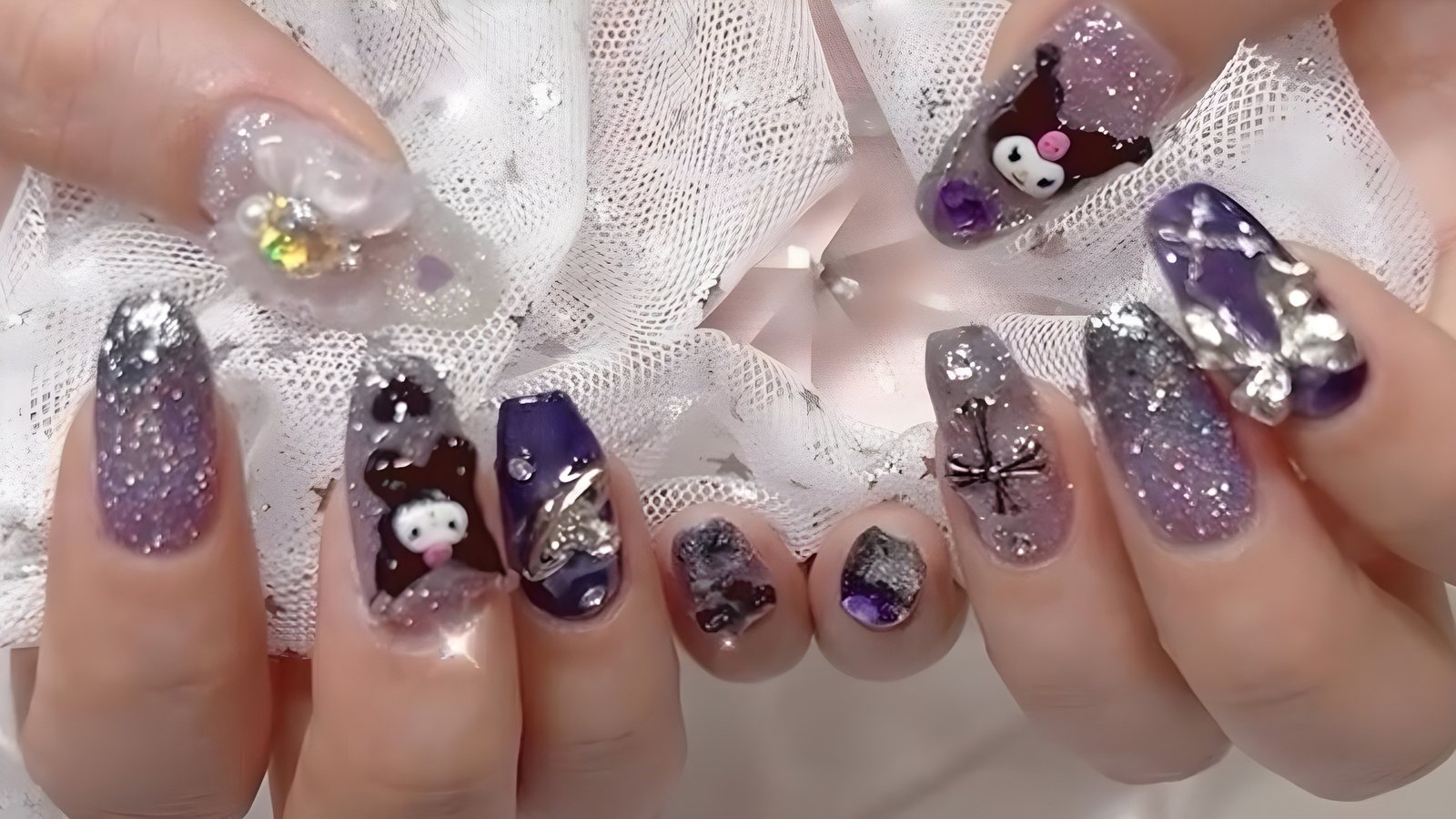 Purple glitter nails with 3D character charms and stones