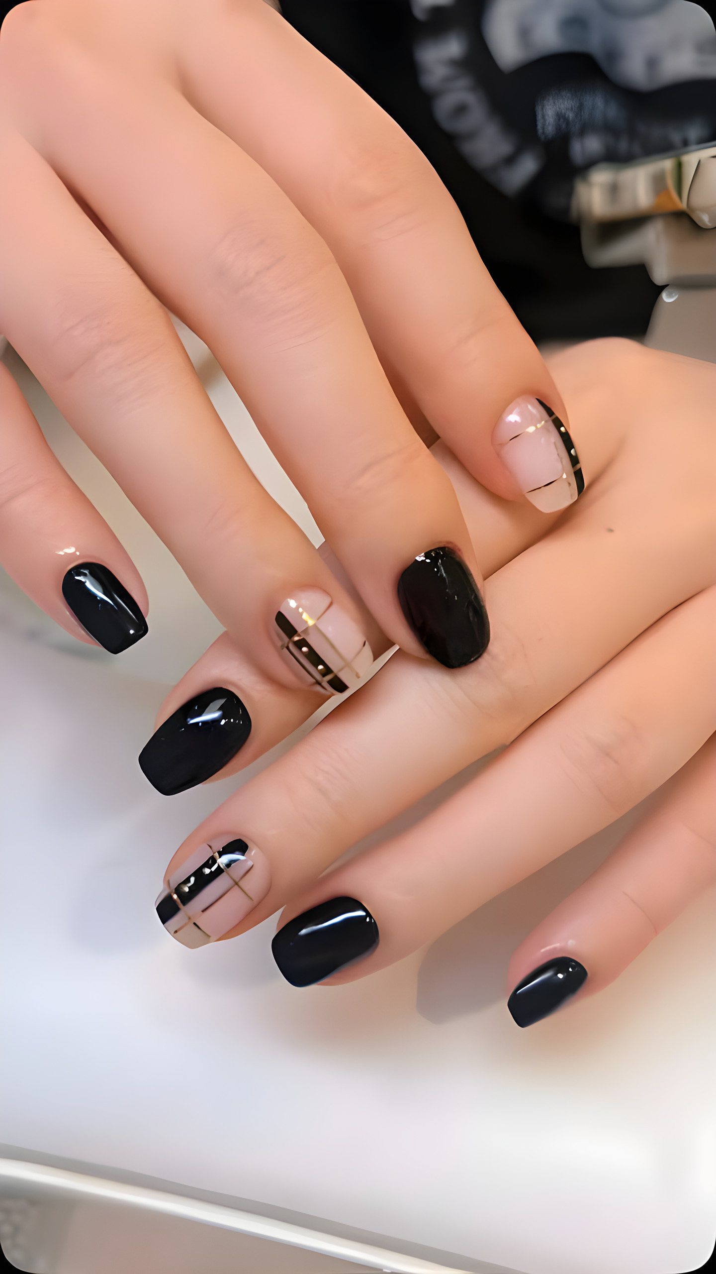 Glossy black nails with fine line art
